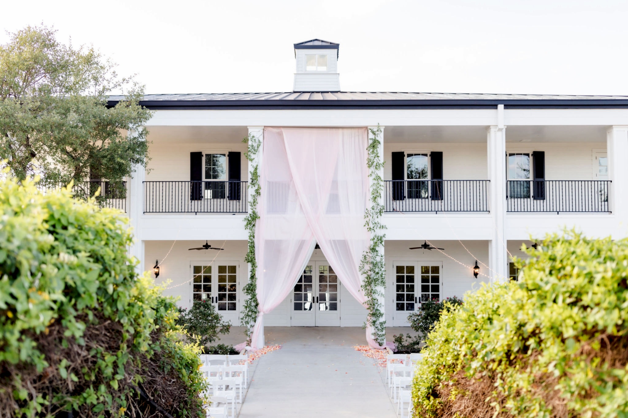 Kendall Point exterior with chairs set up for an outdoor ceremony.