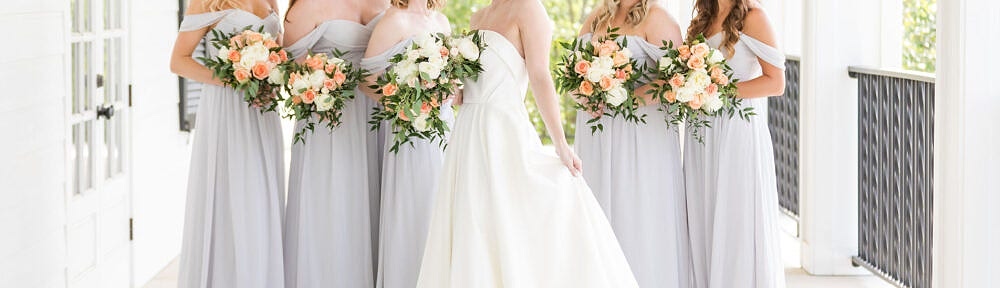 Bride and bridesmaids posing on Kendall Point porch