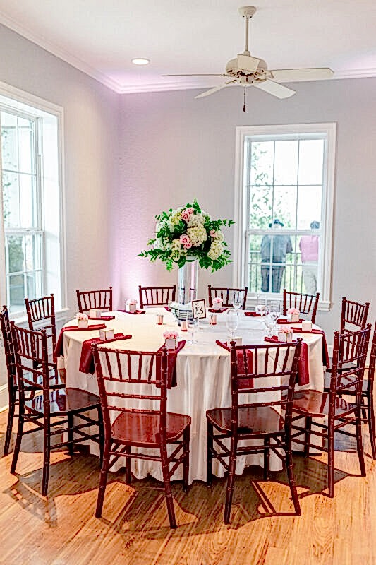 Rose gold adorns the lighting and decor for this table setting.