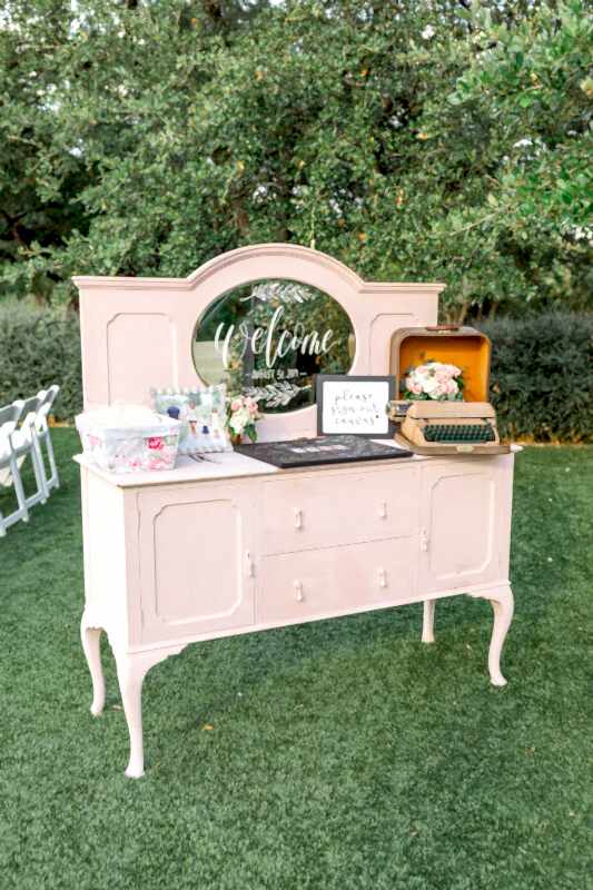 A vintage vanity in pale pink decorates this Kendall Point wedding.