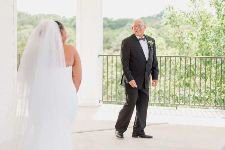 Bride having a special first look moment with her father.