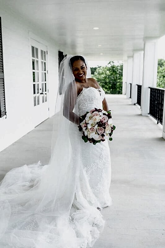 Kendall Point bride posing on veranda.
