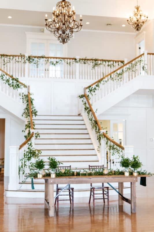 Sweetheart table set up in front of Kendall Point staircase