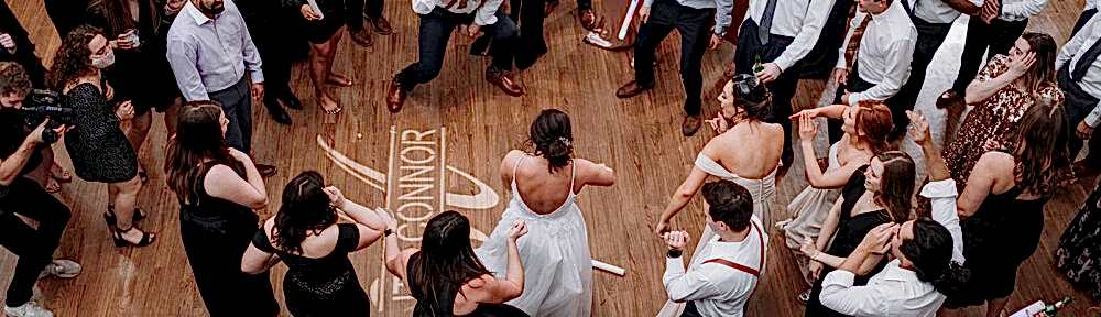 Wedding party and guests dancing during wedding reception at Kendall Point