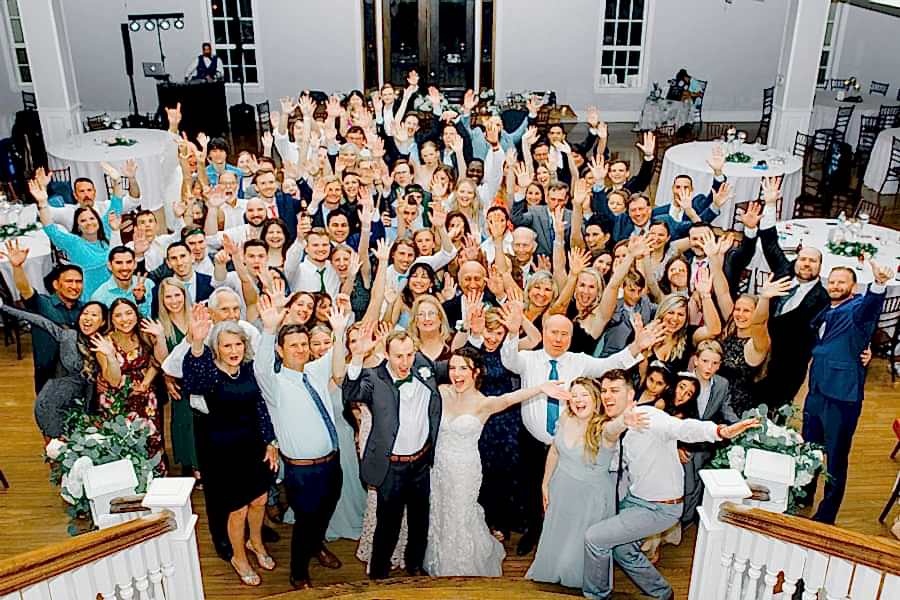 Bride and groom celebrating with all of their guests during their wedding reception at Kendall Point wedding venue in San Antonio