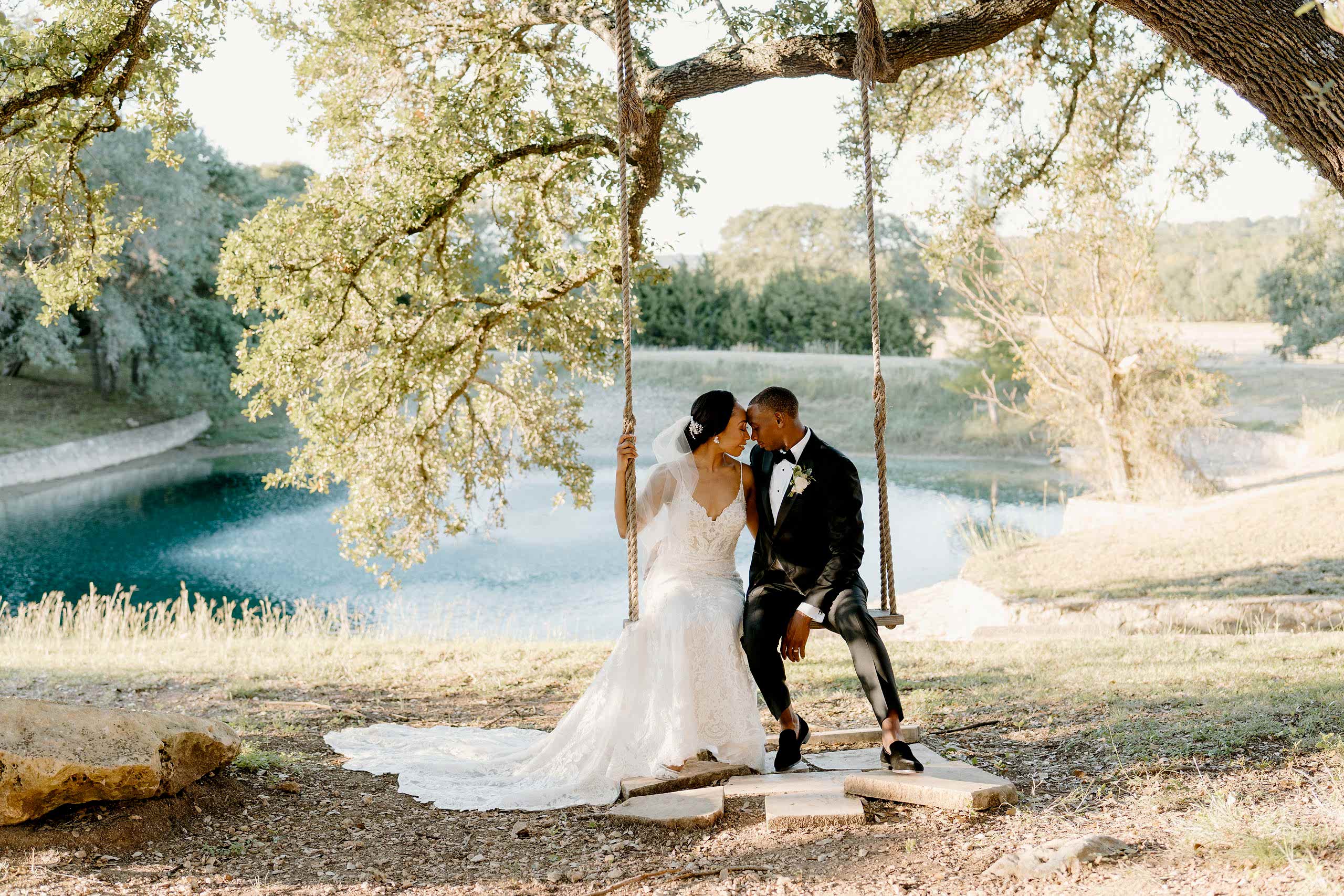 bride and groom on outdoor swing at Kendall Point