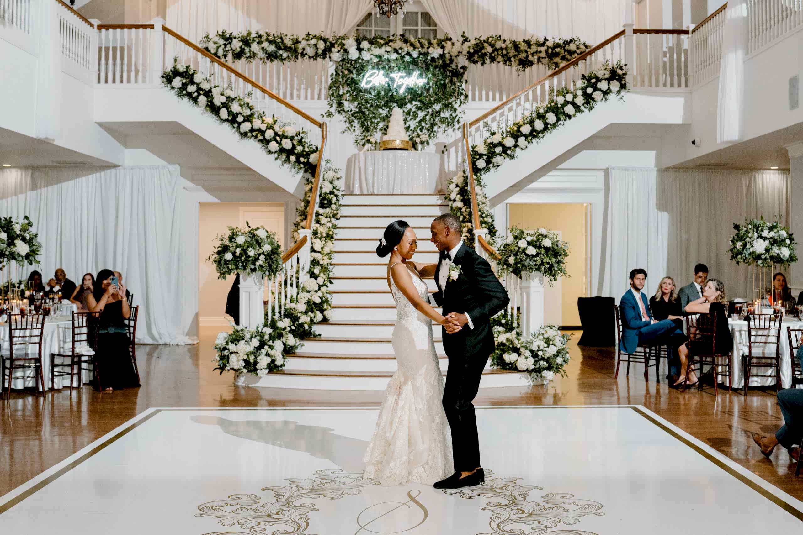 Bride and groom have their first dance in the Kendall Point grand ballroom.