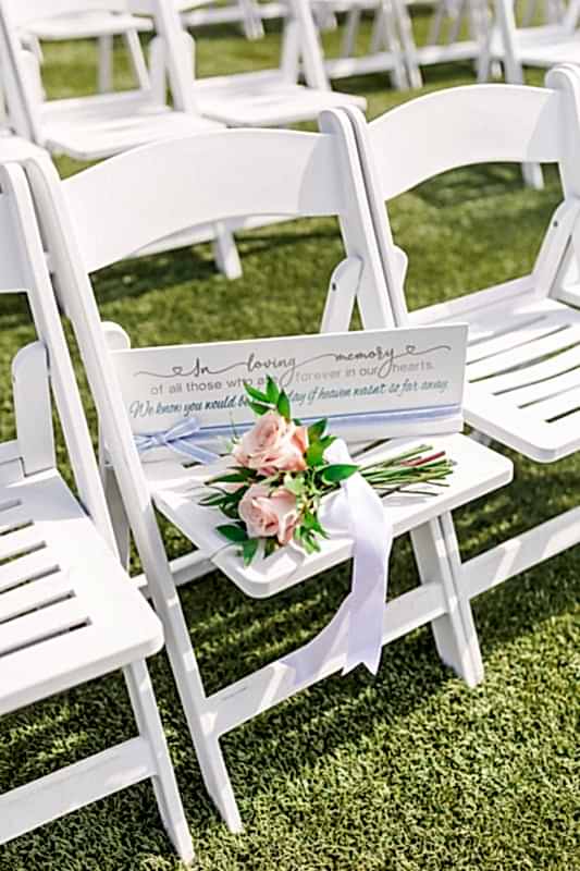 A note and flowers reserving a special seat.