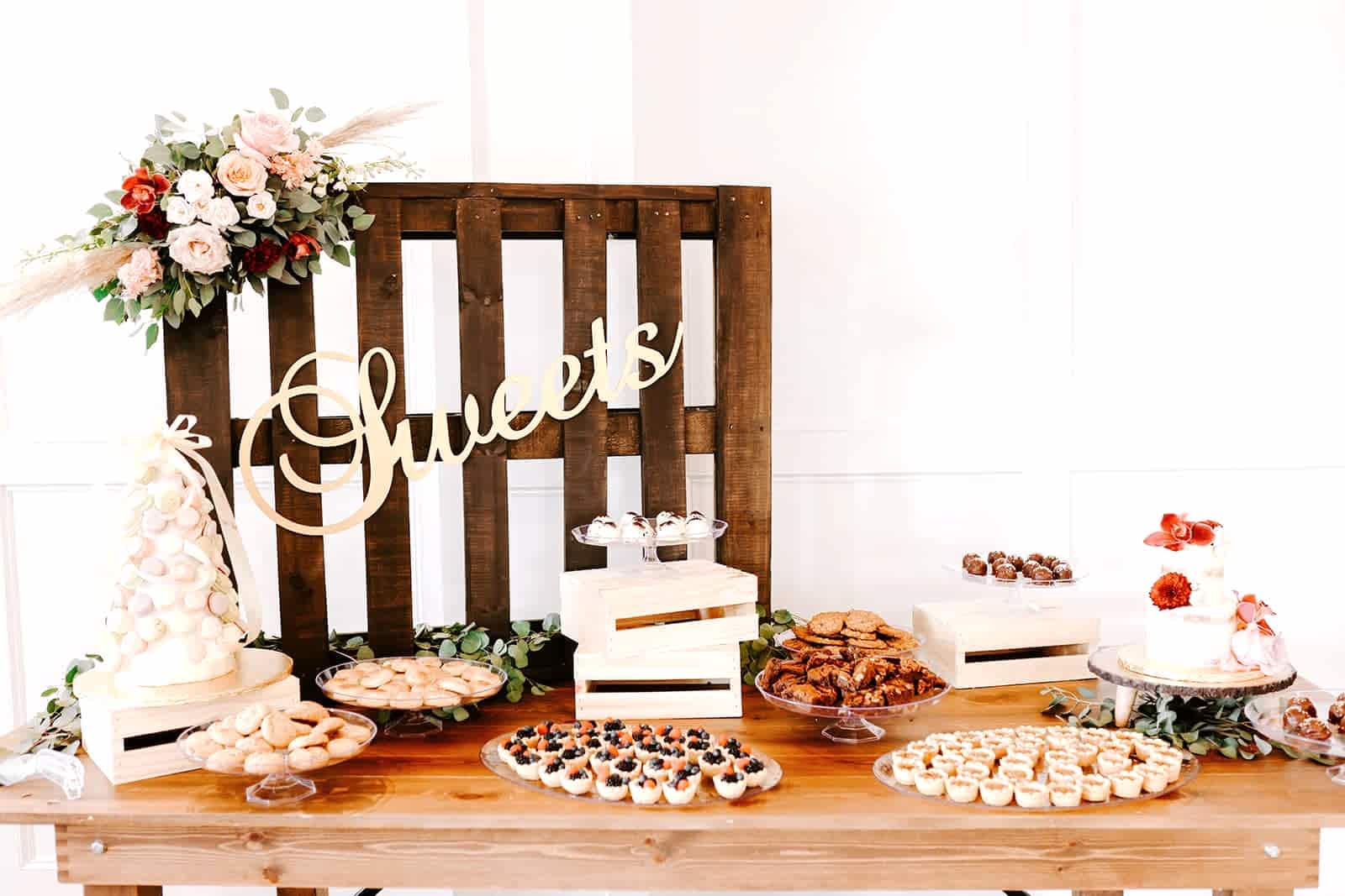 Dessert table at wedding covered in treats