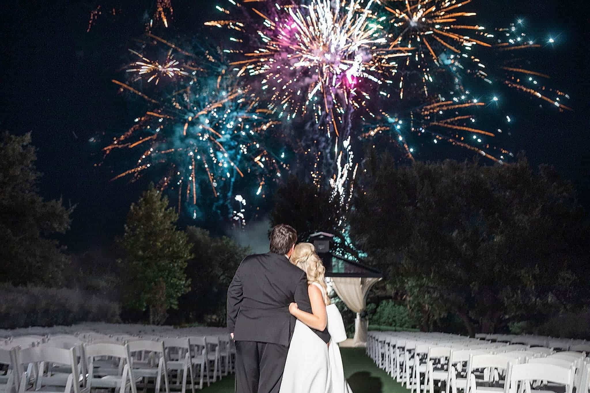 Newlyweds Kendall & John watch the fireworks show at their Kendall Point wedding