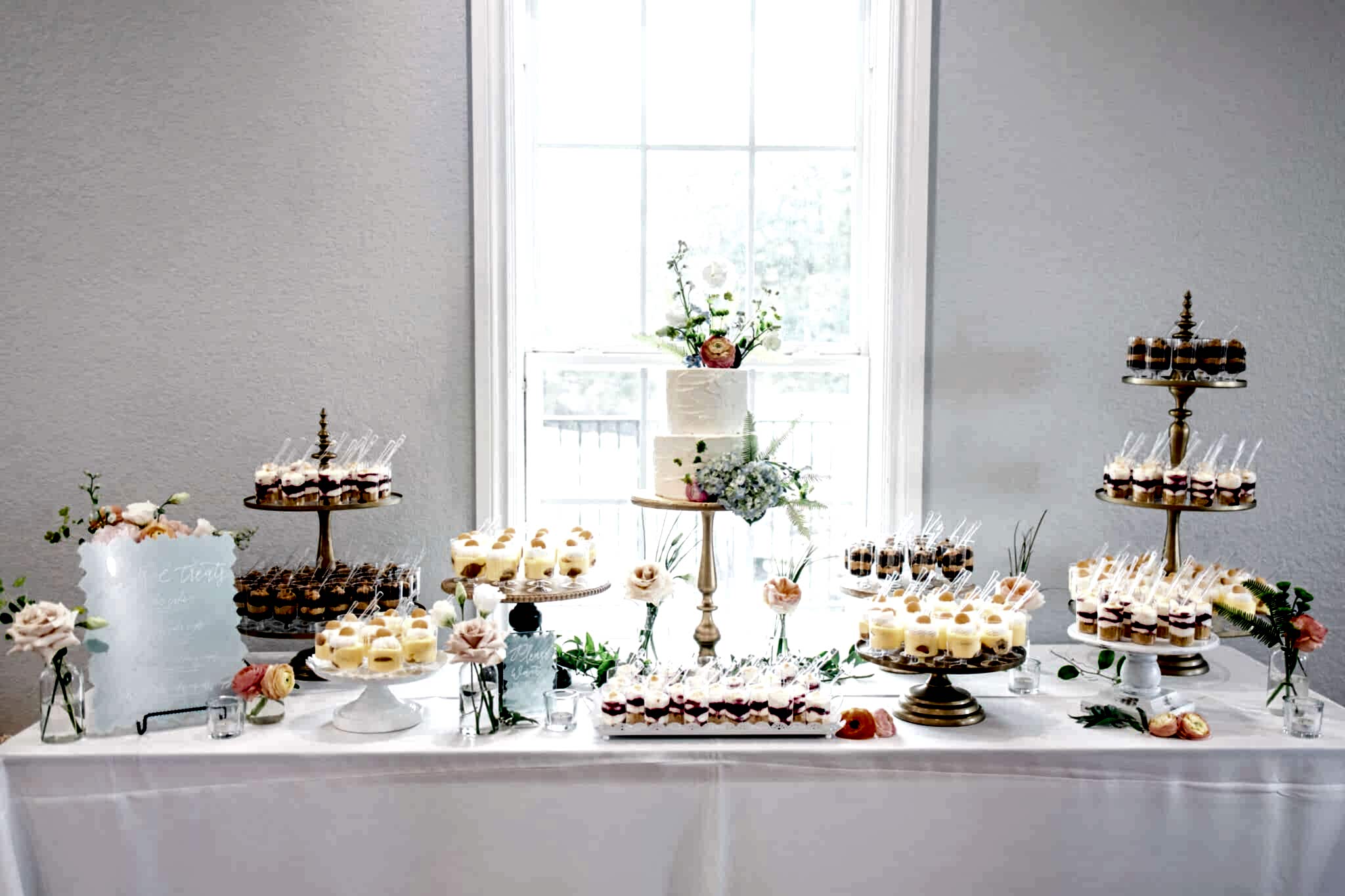 wedding dessert table covered in sweets