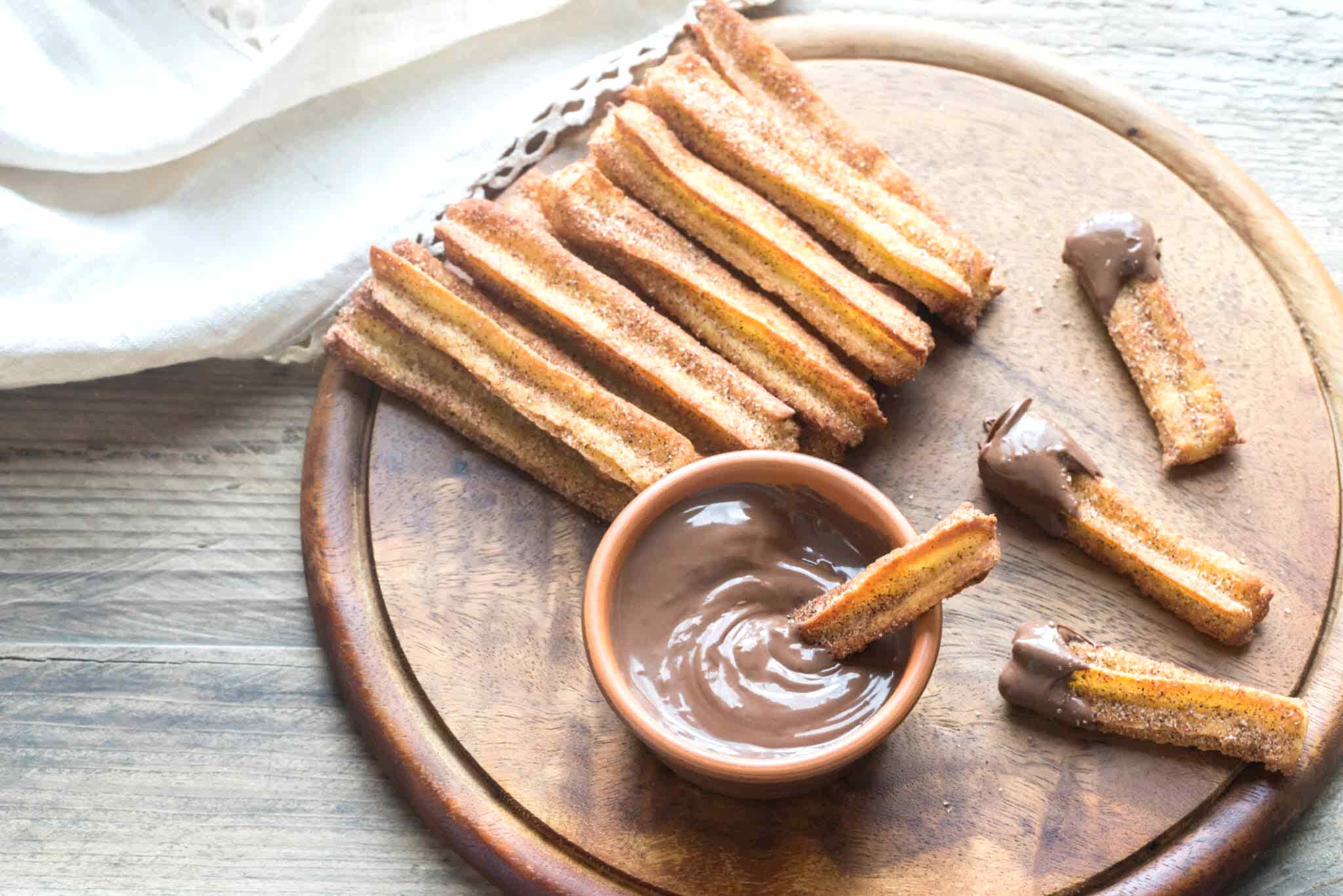 platter of churros with chocolate dipping sauce
