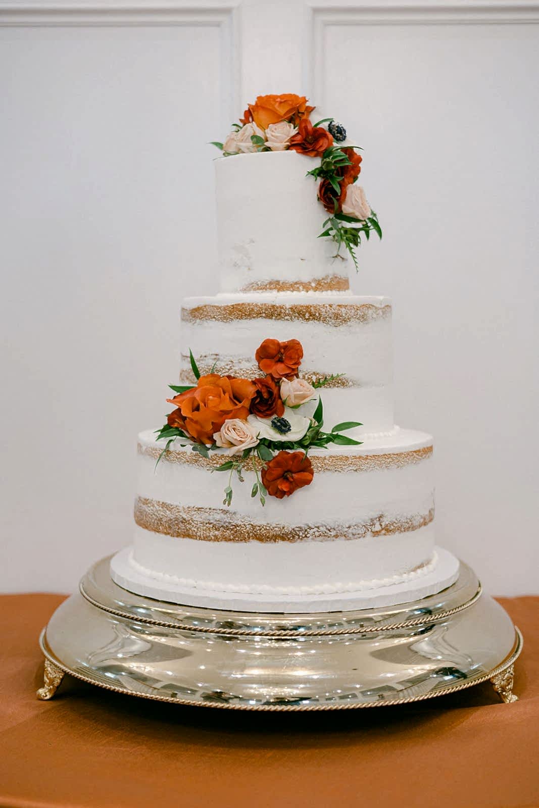 Wedding cake topped with fresh flowers