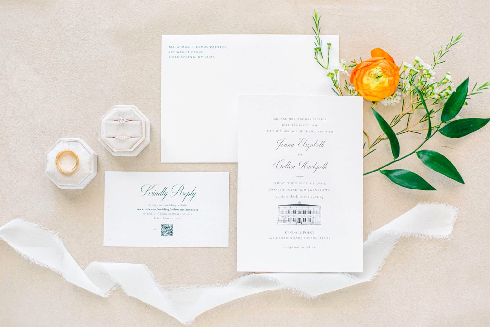 a couple's wedding invitation and their rings laid out on their wedding day at Kendall Point
