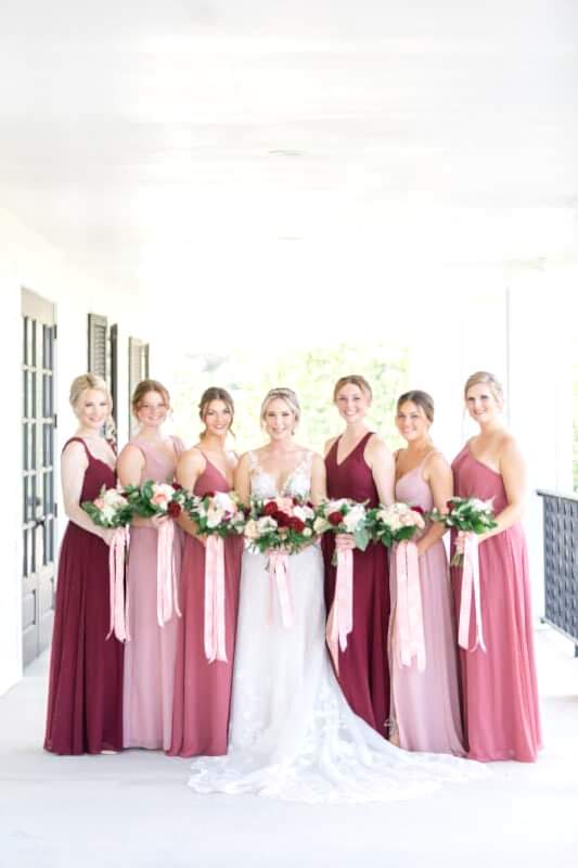bride and bridesmaids standing on kendall point terrace
